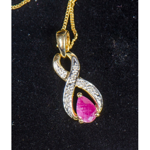 85 - A 9 Carat Gold Necklace, set with rubies and diamonds, along with a pair of stud earrings.
1.6 grams... 