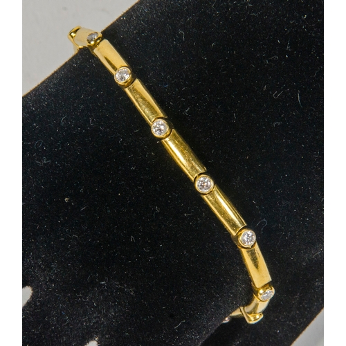 95 - A Gold and Diamond Set Link Bracelet.
16.4 grams.