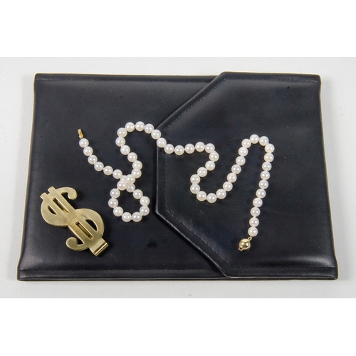 107 - A ladies Pearl Necklace Gold coloured clasp in original black case with a money clip.