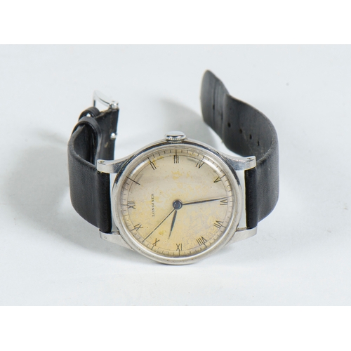 115 - A Gentleman's Longines Wrist Watch with a black strap.