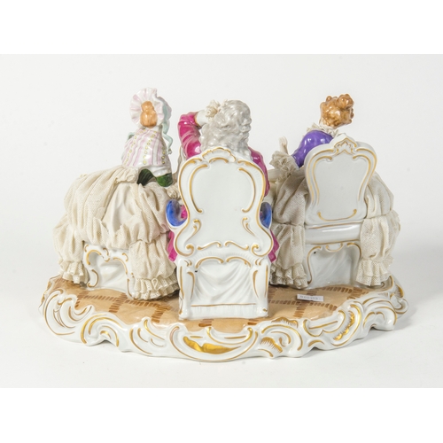 329 - A German Unter Weiss Bach porcelain crinoline group, of two ladies and a gentleman having tea.
8.5 i... 