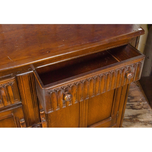 425 - Dark oak Ercol side board, fitted drawers and cupboards, 51 x 35.5 inches.