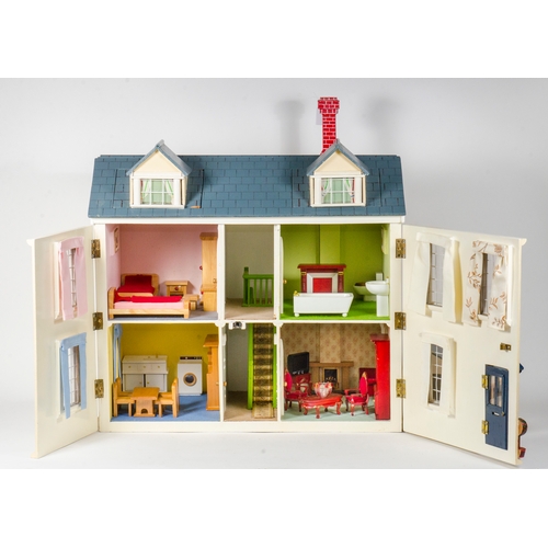 804 - A 2002 Furnished Dolls House. Measuring: H: 24 inches. W: 25 inches.