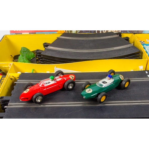 869 - Scalextric Set GP 33 Racing Set complete with boxed Cars including a Ferrari and a Lotus, track and ... 