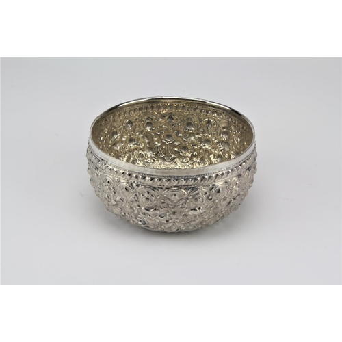 67 - An Indian silver embossed and floral decorated bowl, marked on base IJUN1.