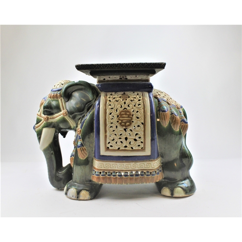 588 - A green glazed garden elephant seat.