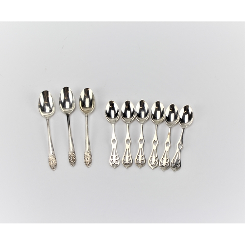 67 - A set of six silver tea spoons, and three others.