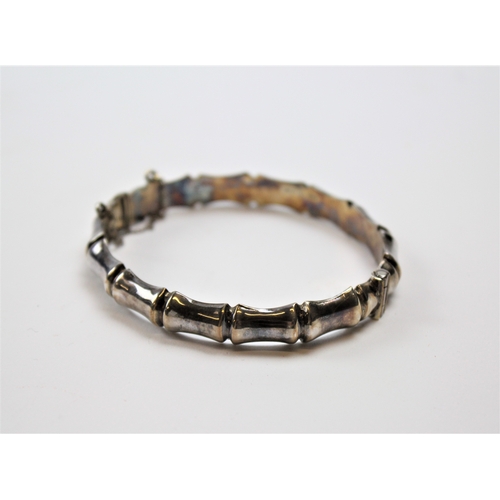 144 - A silver bamboo design bracelet.