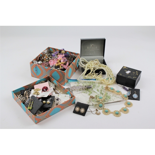 153 - A quantity of costume jewellery, including necklaces, brooches, bangles etc.