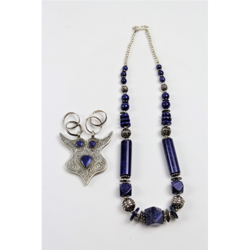 157 - A Lapis Lazuli necklace, silver coloured white metal along with a similar pendent mark as silver.