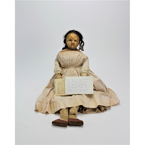 617 - A Victorian wax headed doll, with piercing blue eyes, decorated in a period dress, human hair, pleas... 