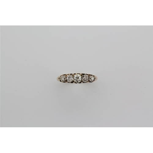 186 - A 18 carat ladies dress ring, set with five diamonds.