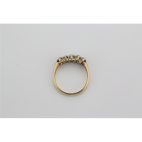 186 - A 18 carat ladies dress ring, set with five diamonds.