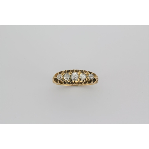 187 - A 18 carat gold ladies ring, set with five graduated diamonds.