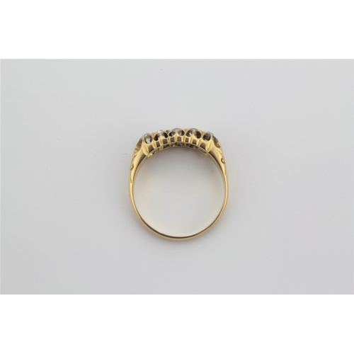 187 - A 18 carat gold ladies ring, set with five graduated diamonds.