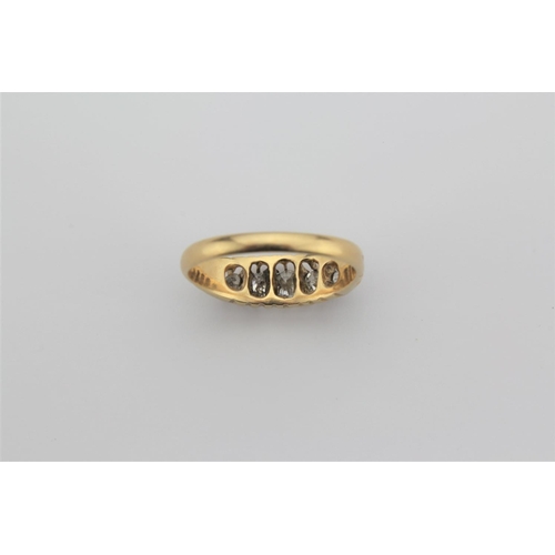 187 - A 18 carat gold ladies ring, set with five graduated diamonds.