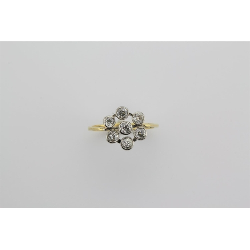 190 - A Victorian design cluster diamond ring, consisting of seven stones.