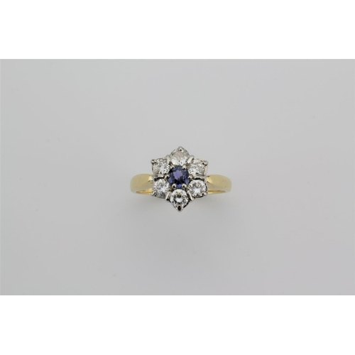 191 - A ladies 18 carat gold diamond and sapphire cluster ring.