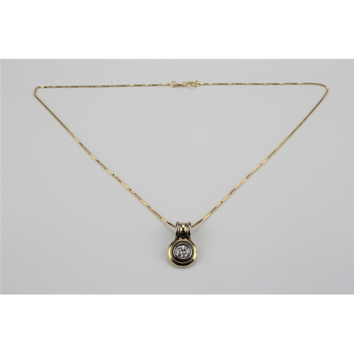 196 - An 18 carat gold diamond bullet pendant, on a fine chain, mounted with a diamond of half a carat.