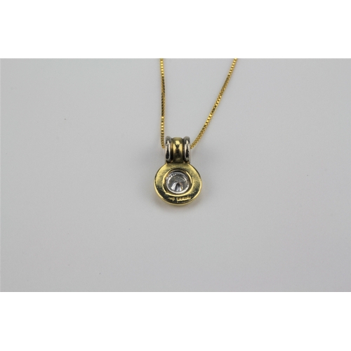 196 - An 18 carat gold diamond bullet pendant, on a fine chain, mounted with a diamond of half a carat.