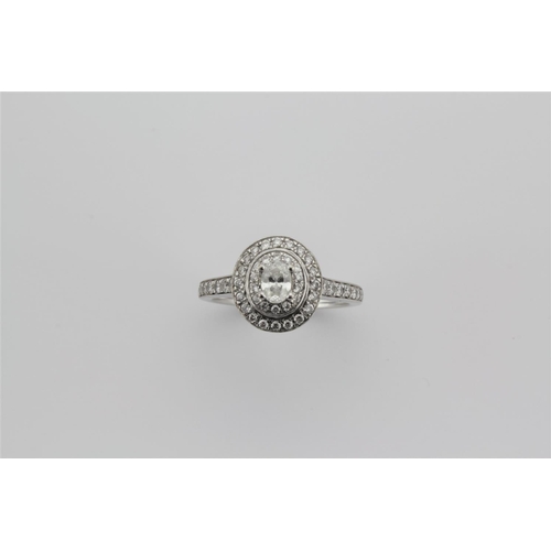 198 - A platinum mounted diamond cluster ring, 3 quarters of a carat.