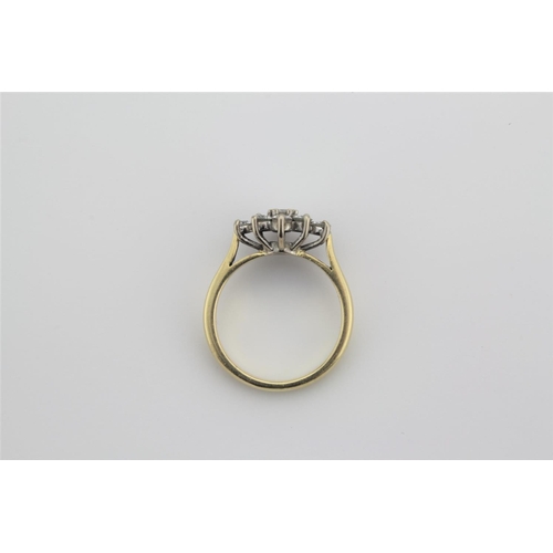 204 - A ladies rectangular diamond set cluster ring, set with nine diamonds, in an 18 carat gold setting.