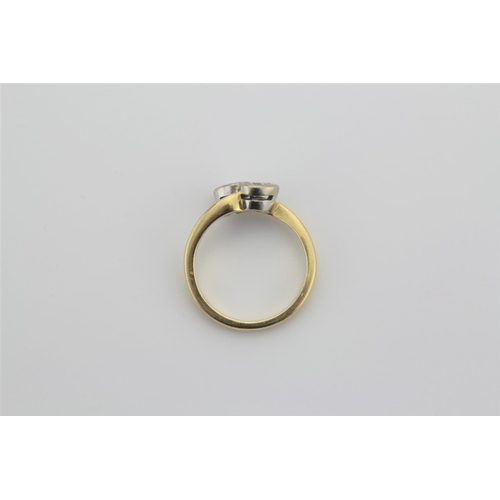 205 - A ladies diamond and 18 carat gold cross over diamond ring.