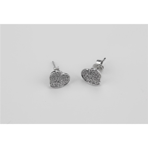 207 - A pair of 18 carat white gold and diamond set heart shaped earrings.