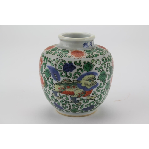 341 - A Chinese Red ground and Green decorated Tibetan market vase, decorated with dogs of Fo, with a vers... 