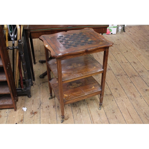 270 - A Victorian inlaid three tiered chess top table resting on square legs.