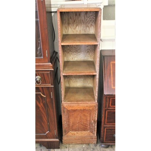 282 - A Heals 1920's limed oak narrow bedside cupboard, fitted with a single door.