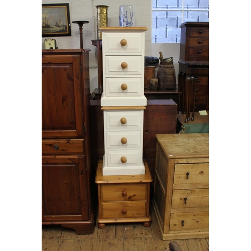 283 - A pair of white painted pine three drawer bedside tables, and another matching two drawer.