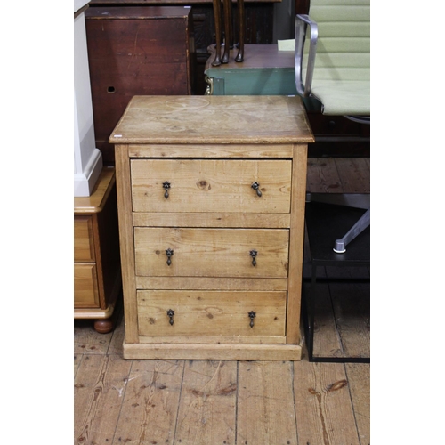 284 - A Victorian scrubbed pine three drawer storage chest, with panelled side.