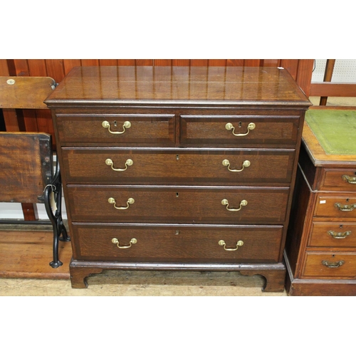 290 - A Georgian oak and mahogany cross banded chest, of three graduated and two short drawers.