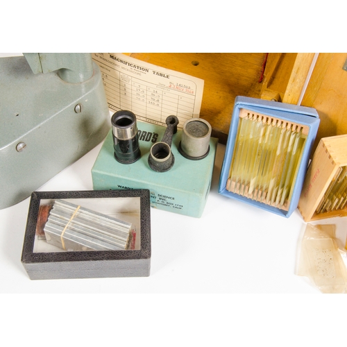 680 - A grey painted Wards binocular microscope, in original case, circa 1960.