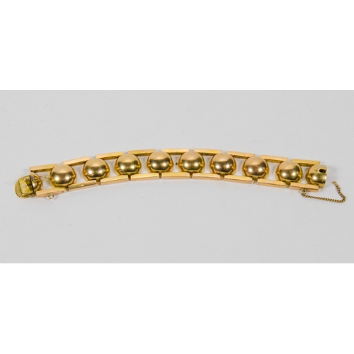 138 - An 18 Carat Gold Ball and Bar Bracelet, modernist design, marked 18K, possibly after a design to 