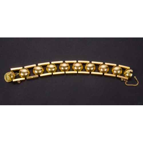 138 - An 18 Carat Gold Ball and Bar Bracelet, modernist design, marked 18K, possibly after a design to 