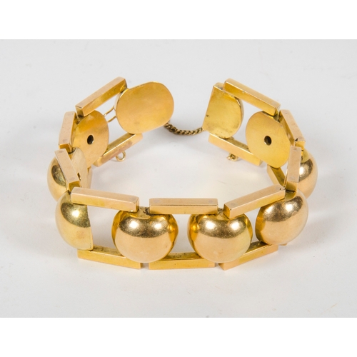 138 - An 18 Carat Gold Ball and Bar Bracelet, modernist design, marked 18K, possibly after a design to 