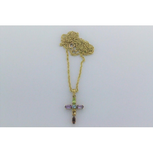 77 - A 9 carat gold cross necklace, set with various coloured stones, set on a gold chain. 4.8 grams