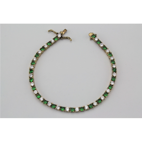 104 - A green stone and paste bracelet.