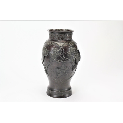 515 - A Japanese bronzed vase, decorated with the bird of prey. 32cm high.