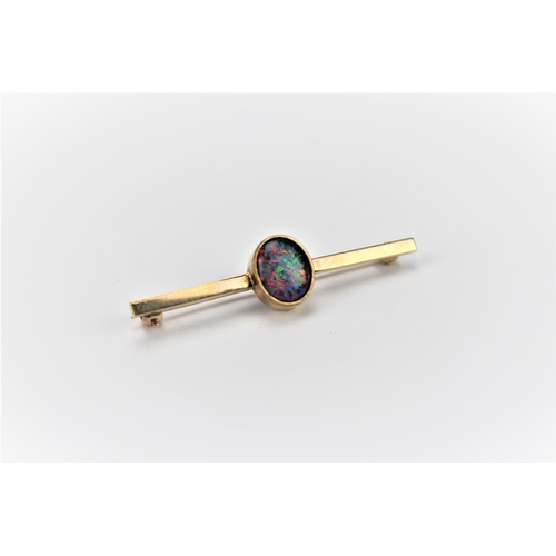 76 - A 9 carat gold brooch, set with an opal doublet.