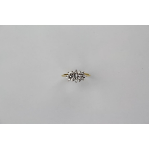 106 - A ladies 18 carat gold diamond and baguette cluster ring, mounted with 12 brilliant cut diamonds and... 