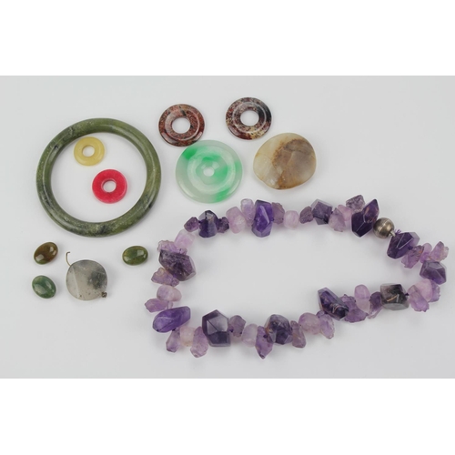 121 - A natural amethyst crystal necklace, jade hard stone bangle etc.