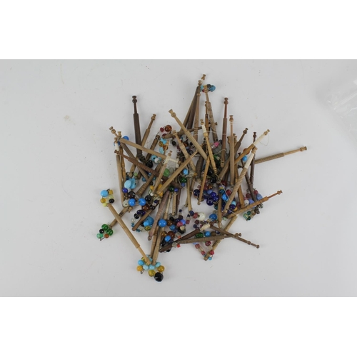 612 - A large collection of 18th & 19th century bead work & other bobbins.