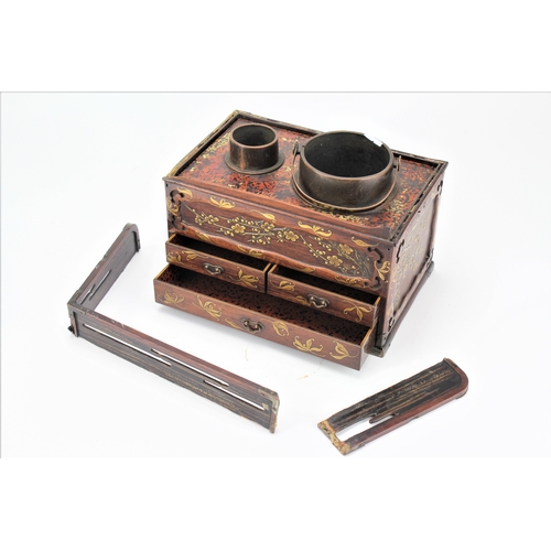 521 - A Japanese lacquered Maki and Hiramaki'e smokers box, with a fitted tray burner etc.