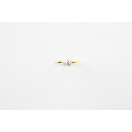 118 - A ladies single stone diamond ring, set in 18 carat gold. Size M.5.