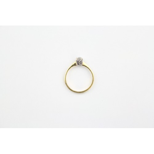 118 - A ladies single stone diamond ring, set in 18 carat gold. Size M.5.