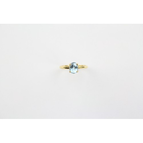 107 - A ladies 18 carat gold topaz ring. Size M.