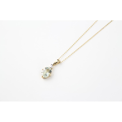 113 - A ladies gold mounted aquamarine necklace, on a fine gold chain.